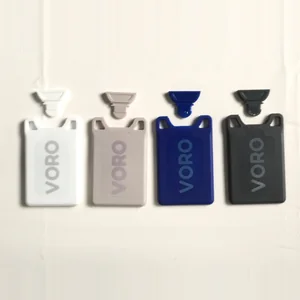 All four VORO cards with the applicator lifted out of each one: White, Pistachio Shell, Navy, Charcoal.