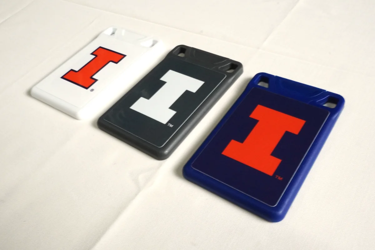Three VORO cards in White, Charcoal and Navy, each printed with the University of Illinois Block I