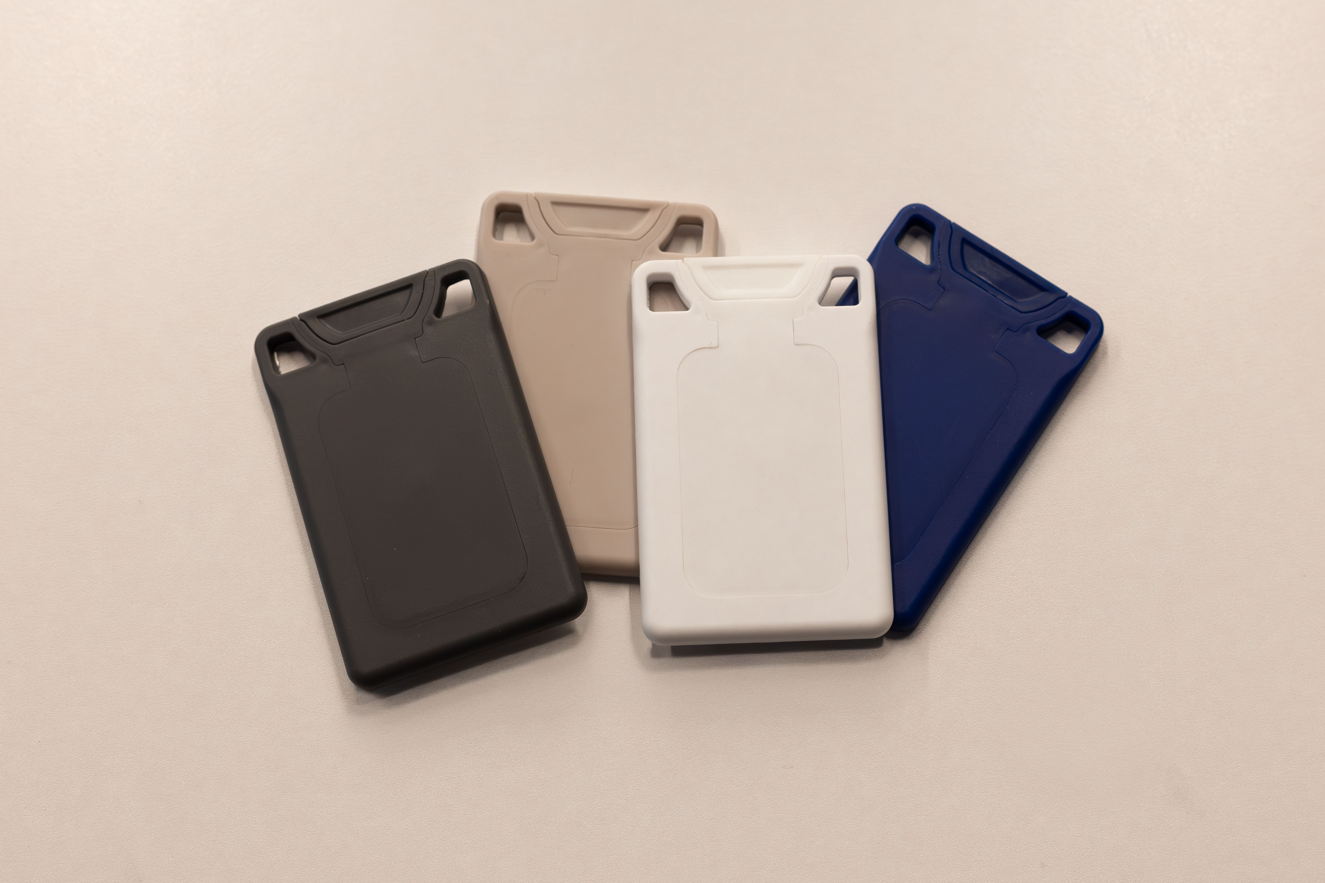 All four VORO colorways fanned out: charcoal, pistachio, white, and navy.