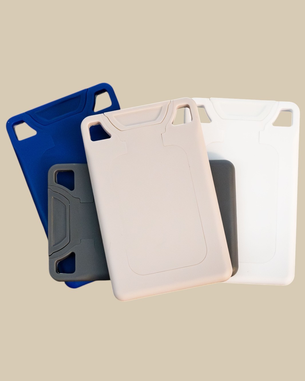 VORO's flat lip-care cards in Navy, Charcoal, and White, overlapping.