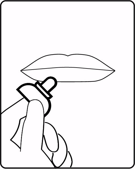 Gliding the VORO applicator across the lips.