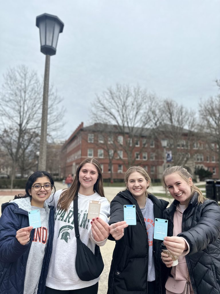 Pre-launch testers holding VORO lip balm prototypes.